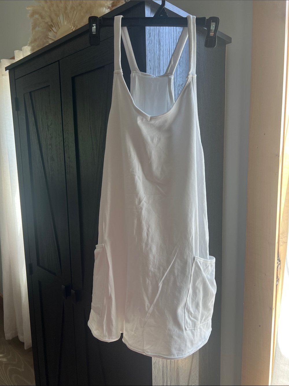 White Sleeveless Dress with Side Pockets and shorts